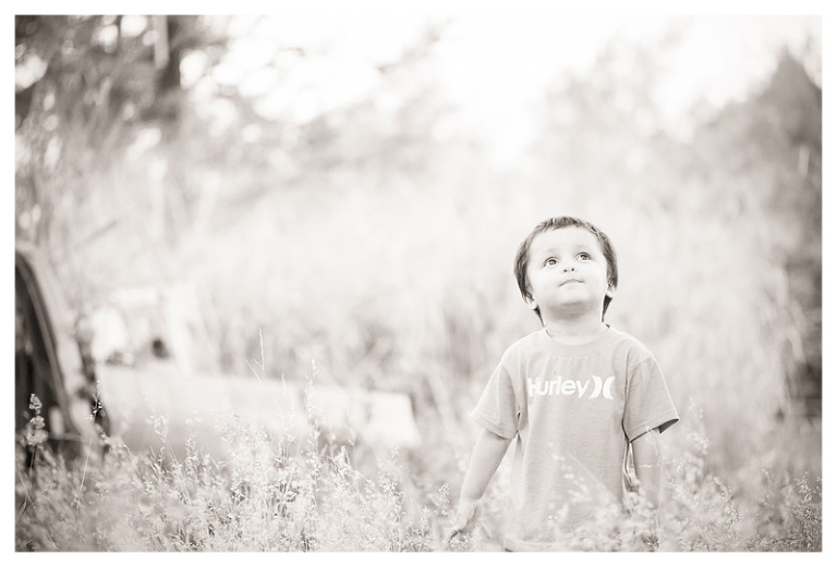 b/w Big Island Hawaii Photograph of boy in wild field by Big Island Hawaii Photographer