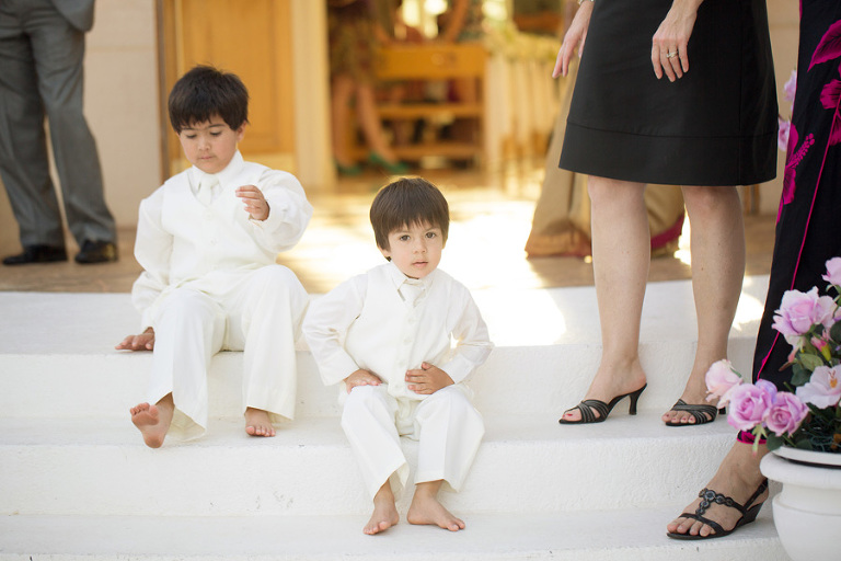 ringbearers on the steps of Paradise Cove Crystal Chapel on Oahu