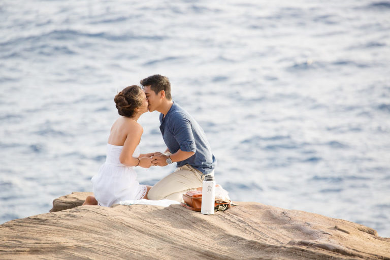 kiss between newly engaged couple after marriage proposal