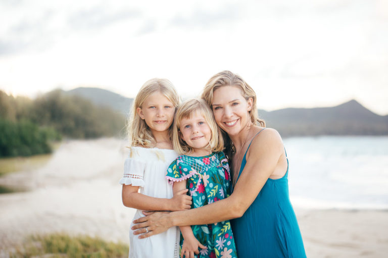 mom and daughters hugging in Hawaii family photo