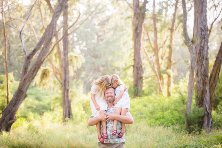 dad and daughters in family photo