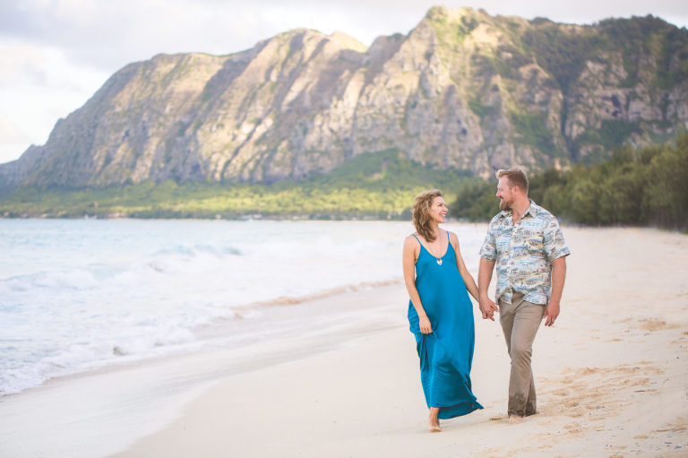 couple walking on beach on north Oahu