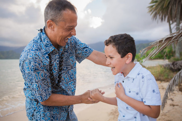dad and son laughing together