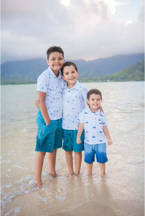 three brothers on Oahu smiling for photo