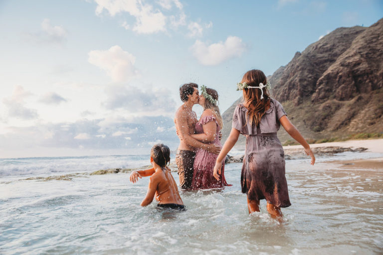 fun family photo with a kiss and splashing