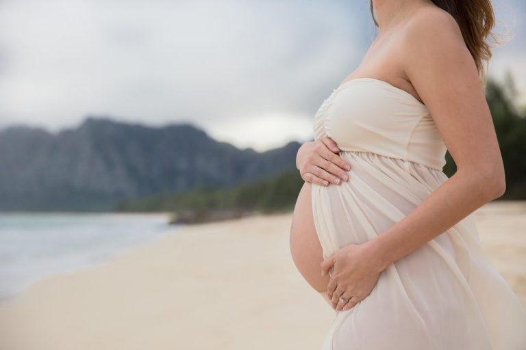 baby bump on Hawaiian beach shoreline