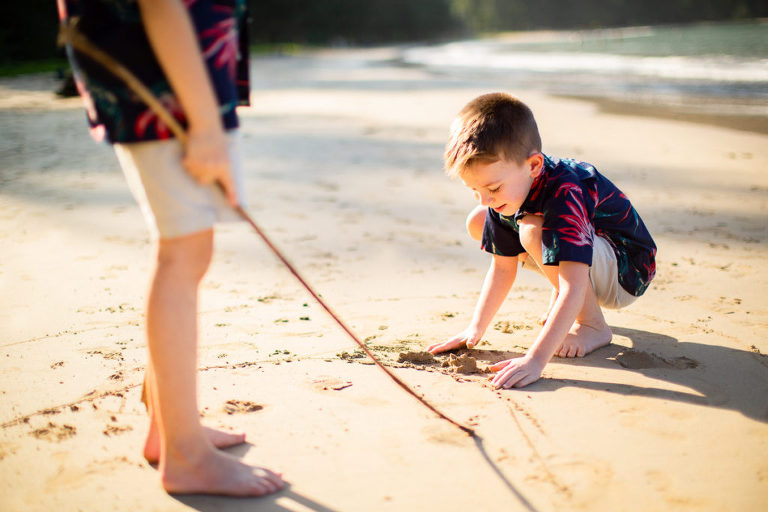 boy adventures on the beach of Oahu